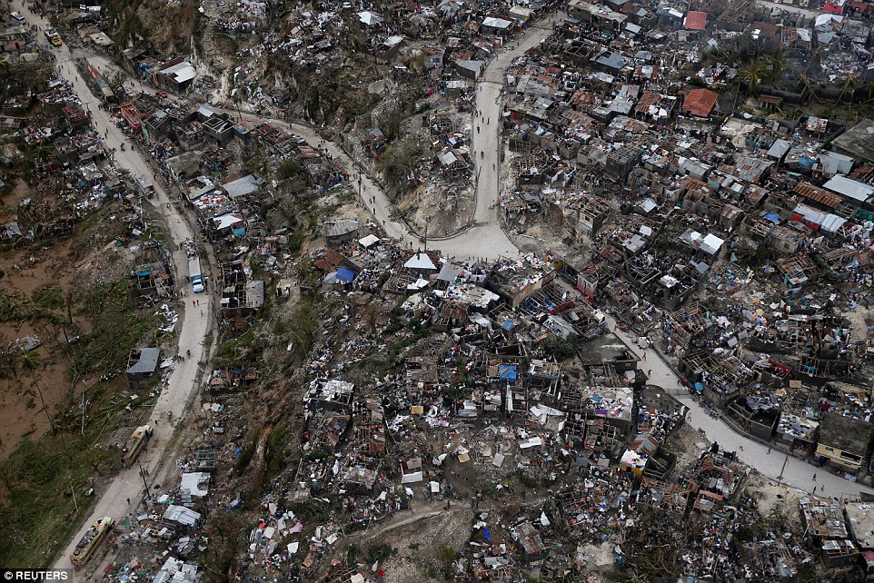 In ruins: Villages were leveled by 145 mph winds as the Category four storm brought floods, wreckage and misery to Haiti on Tuesday and Wednesday